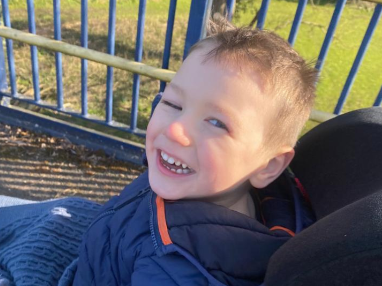 Tate grinning to camera