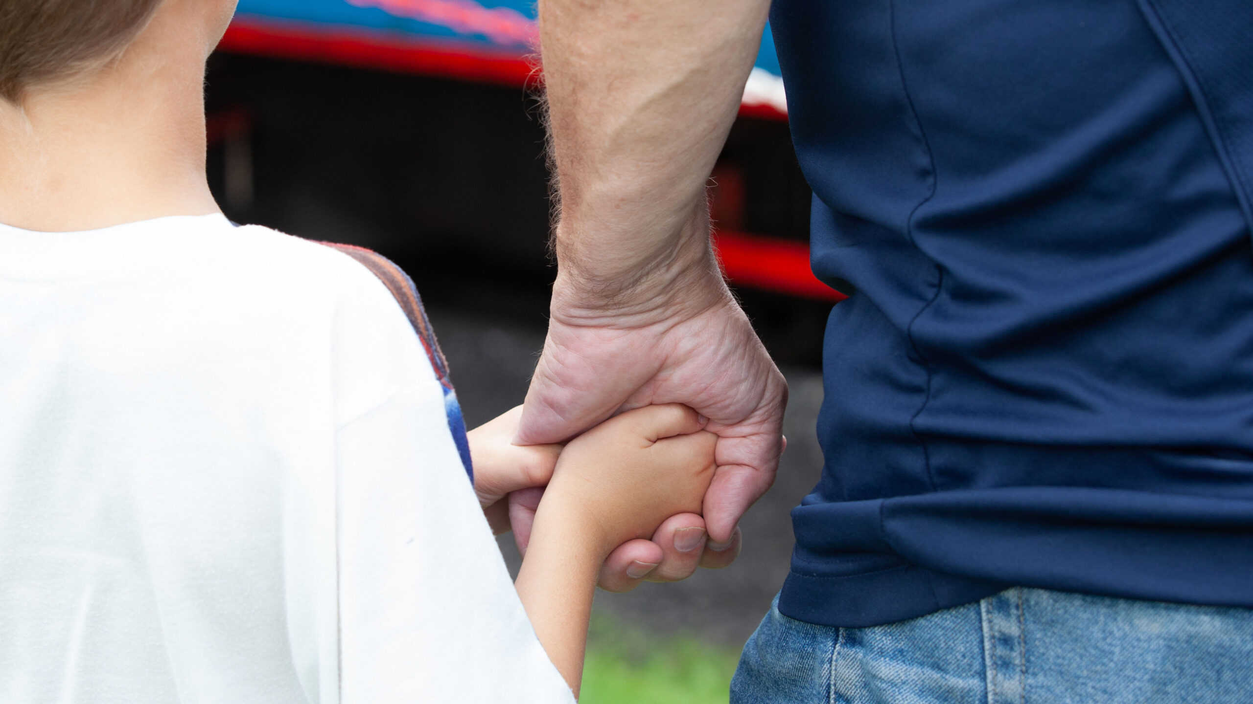 Parent and child holding hands