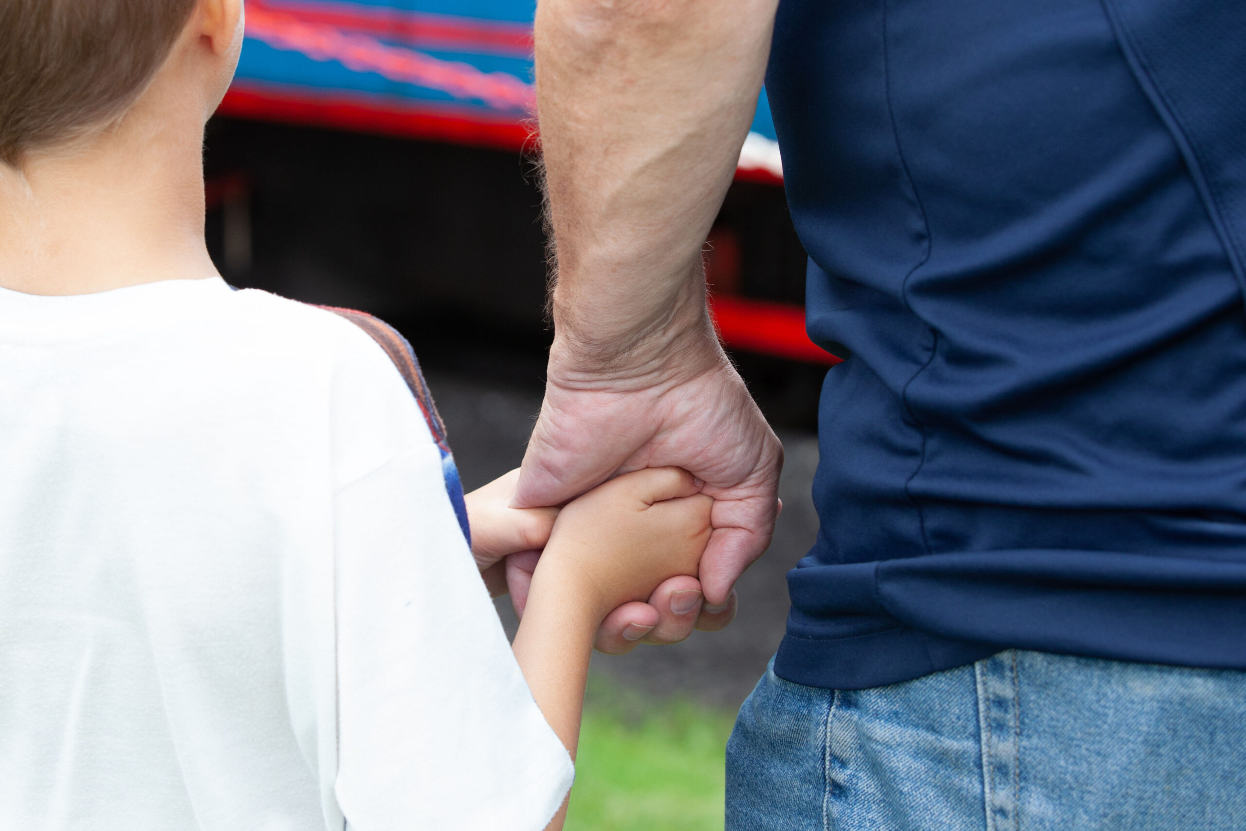 Parent and child holding hands