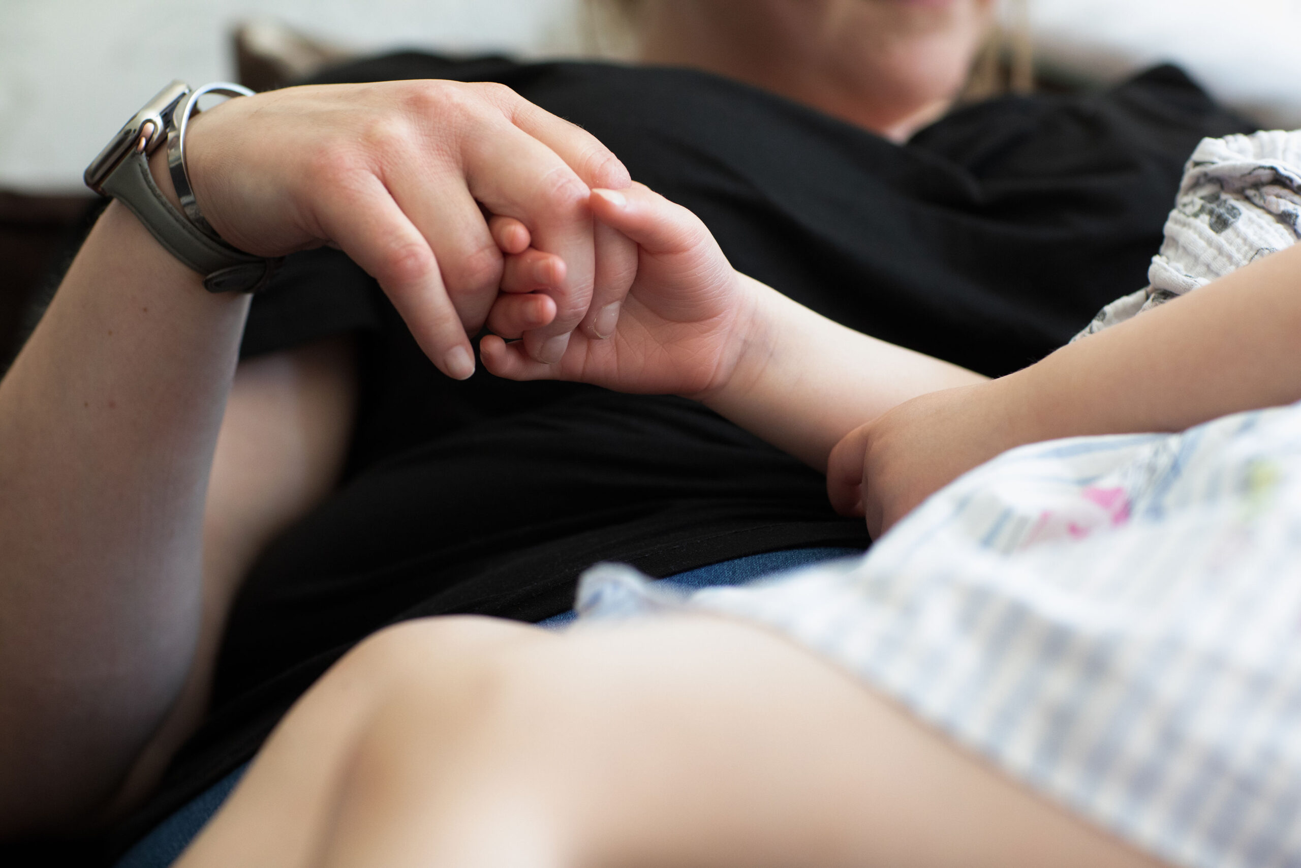 Parent and child holding hands