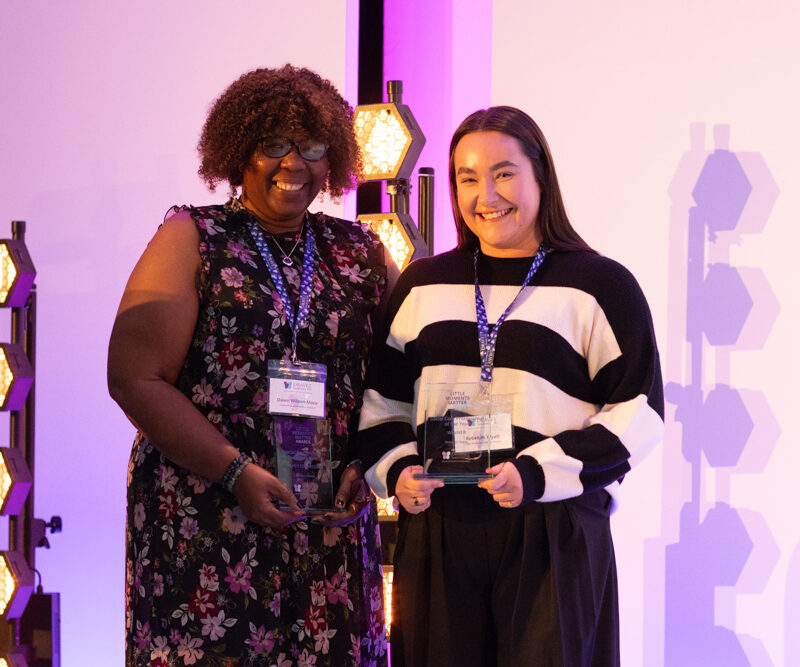 Dawn Wilson‑Mace and Rebekah Wyatt receiving their awards