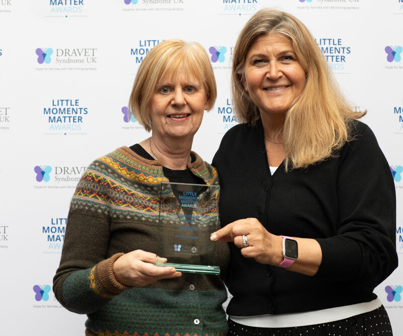 Dr Elaine Hughes receiving her award from Galia Wilson